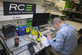 Re-Circuit Electronics technician rebuilding a GM truck instrument cluster at the Toledo shop